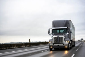 Big,rig,stylish,industrial,dark,gray,semi,truck,with,turned