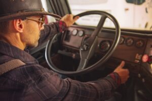 Caucasian,cowboy,truck,driver,in,western,hat,and,sunglasses,setting