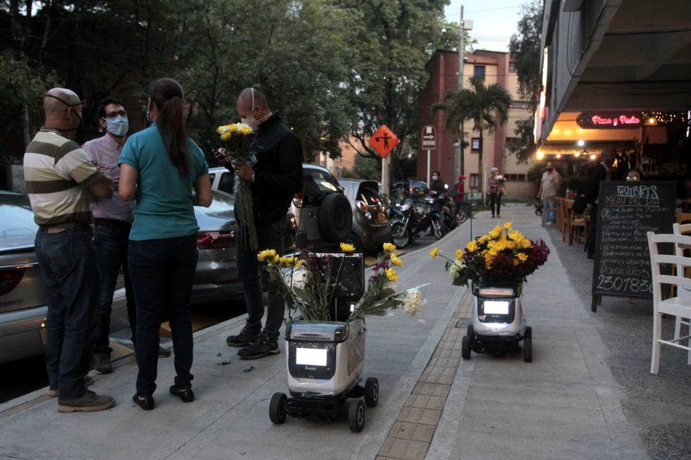 two-flower-delivery-robots-remain-on-the-sidewalk-for-news-photo-1615138475_ | Zinda Law Group, PLLC It's A Robot! It's A Pedestrian! It's Both.