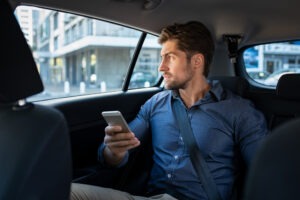 A rideshare passenger calls a Colorado Springs accident lawyer after an accident.