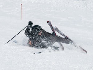 A skier hurt on a mountain slope and in need of the services of an experienced ski injury accident lawyer serving Albuquerque.