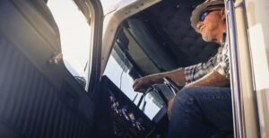 Man in truck cab with open door